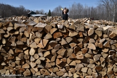 Roger Chaloux taking a break after stacking wood.