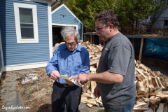 Hector Chaloux (right) with customer afater delivering wood in Montpelier.