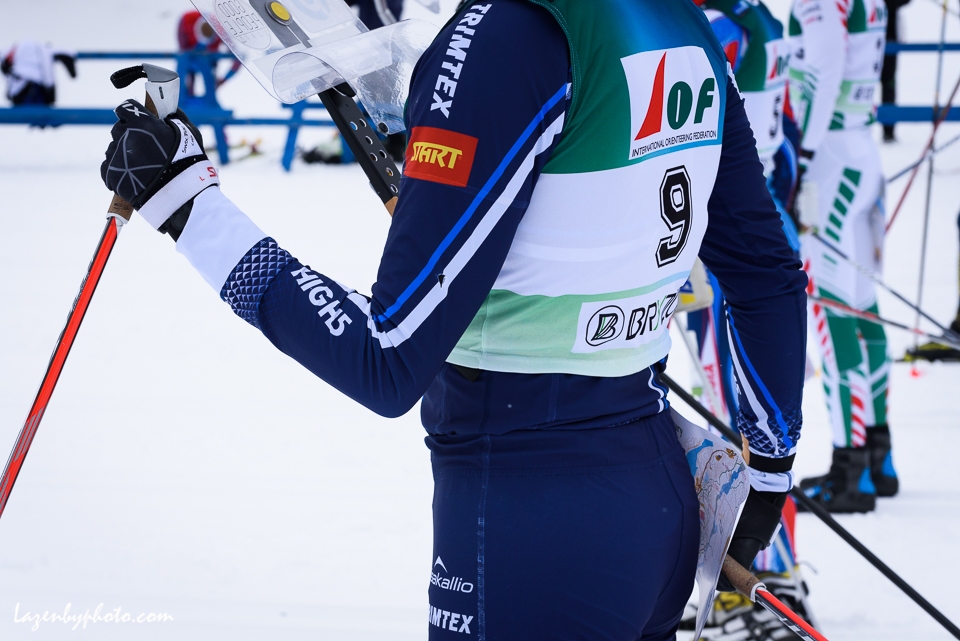 Finnish competitor holds map behind his back before the start of  the distance race at the International Orienteering Federation World Cup at Craftsbury Outdoor Center, Craftsbury, VT. She teamed with Eduard Khrennikov .